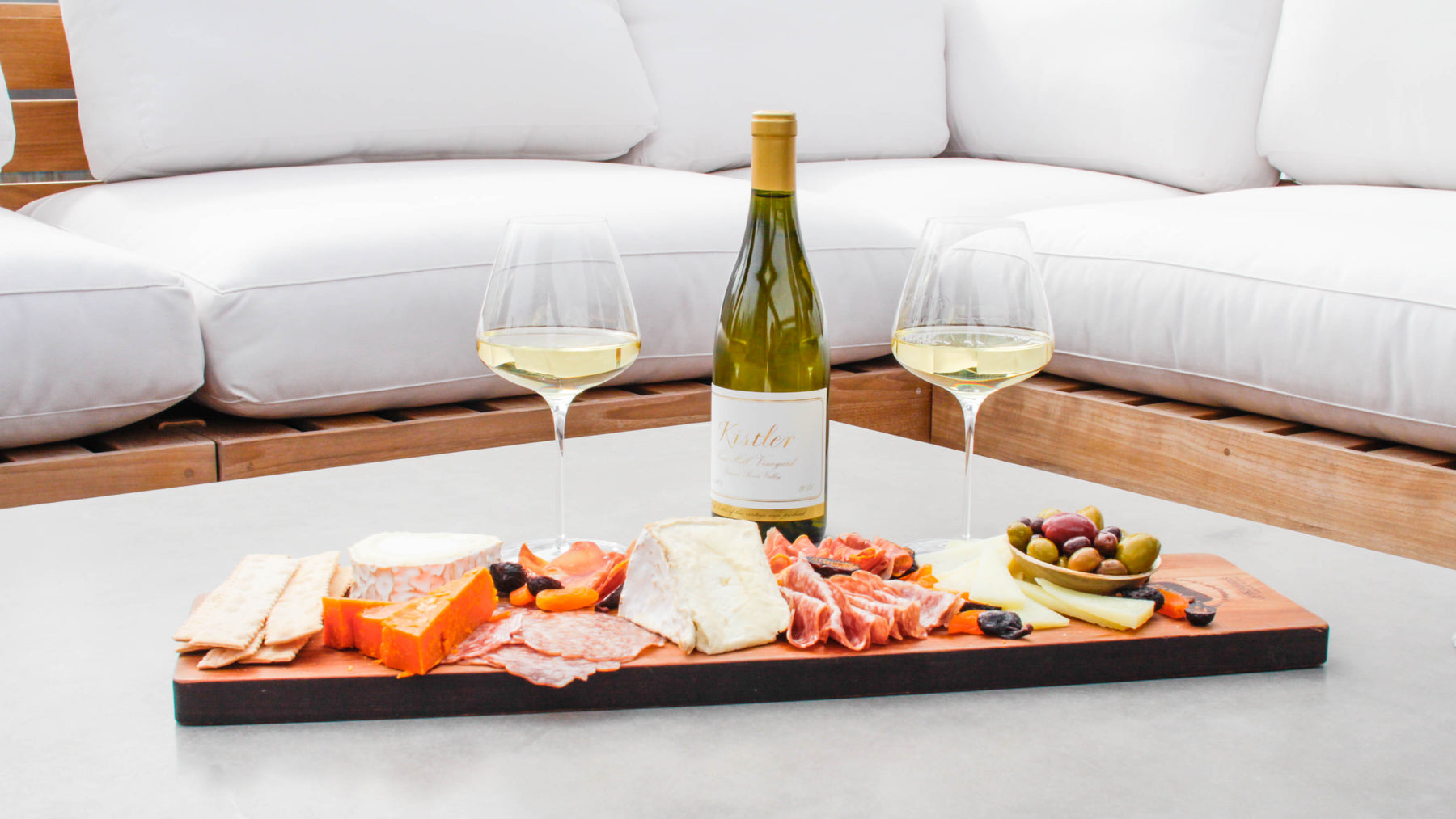 two grassl wine glasses filled with white wine