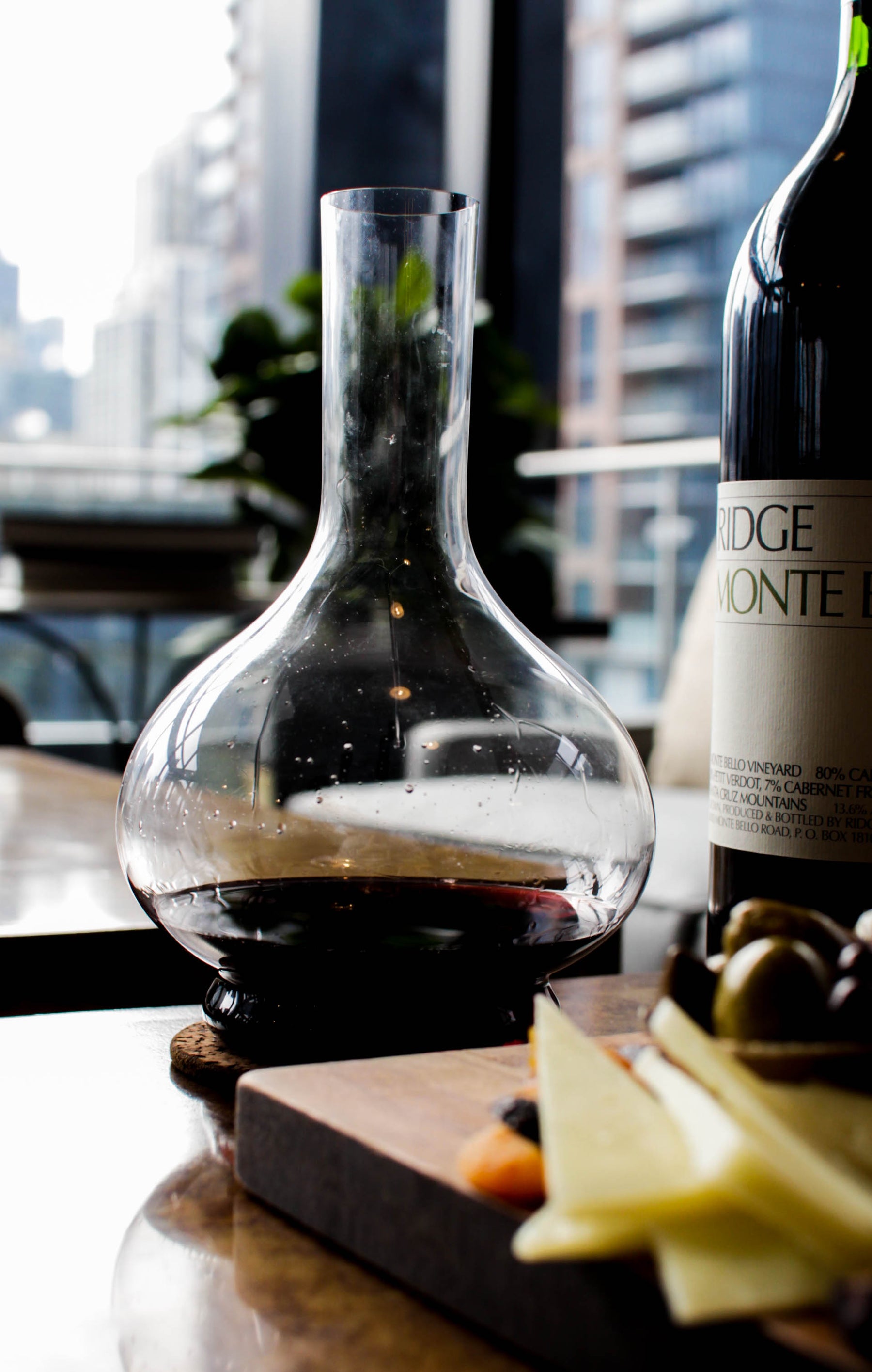 grassl glass wine decanter filled with red wine on table
