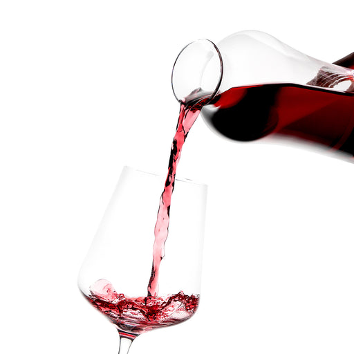 Pouring wine from a Grassl Carafe into a wine glass